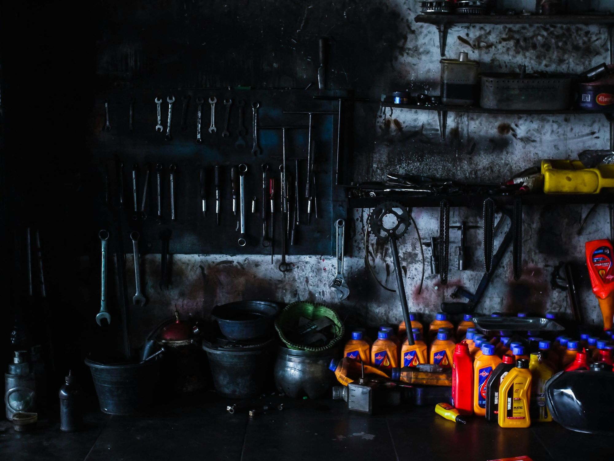 Wall of mechanic's wrenches and tools above a workbench